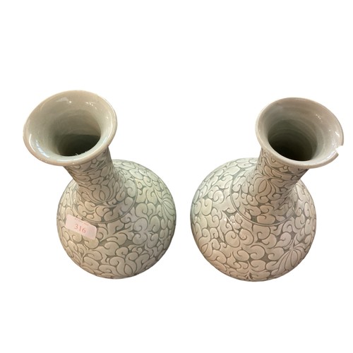 223 - A pair of decorative, Chinese Celadon style bottle neck vases  29cm High, chip to rim