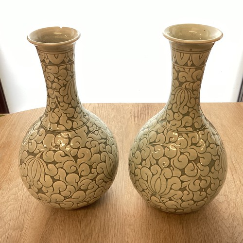 223 - A pair of decorative, Chinese Celadon style bottle neck vases  29cm High, chip to rim