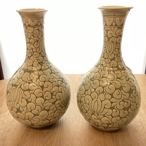 223 - A pair of decorative, Chinese Celadon style bottle neck vases  29cm High, chip to rim