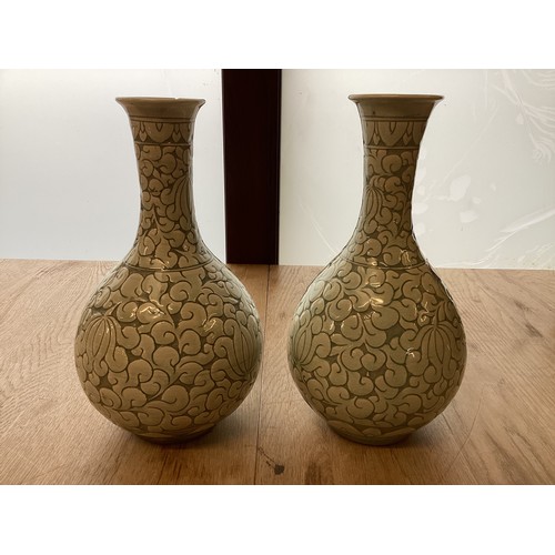 223 - A pair of decorative, Chinese Celadon style bottle neck vases  29cm High, chip to rim