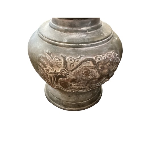 224 - A pair of Chinese bronze urn alter pieces, each urn with raised dragon decoration, 31cm High