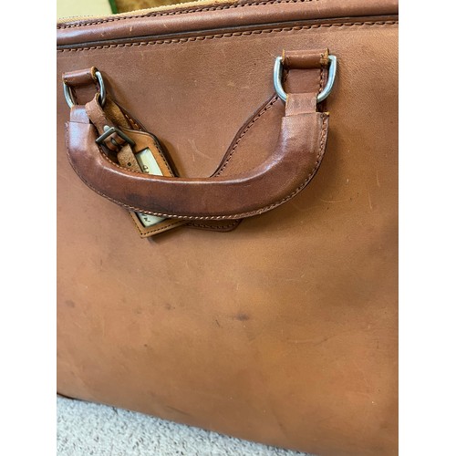 230 - A leather case with zip and straps, initalled M A H C, and makers label to inside, Norris, made in E... 