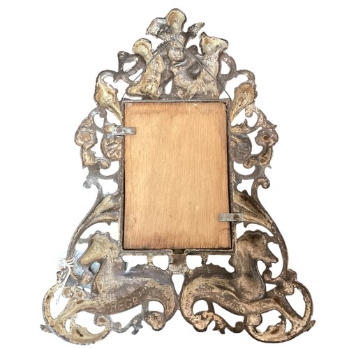 221 - A vintage bronze effect ornate frame with cherub and sea horses, approx 34cm High