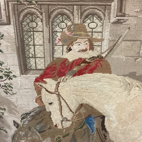 432 - Large framed and glazed tapestry of period courtyard scene of a cavalier man and horse  85cm x 118cm