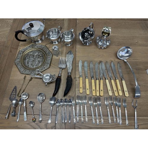 36 - A collection of silver plated wares to include an Art Deco style three pieces tea service  and other... 