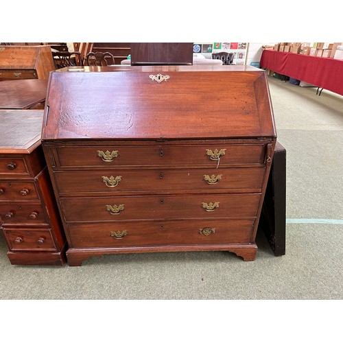 537 - A Georgian mahogany four drawer bureau, with fitted interior and keys, 105cm wide, some losses