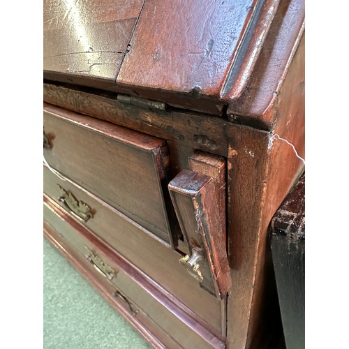 537 - A Georgian mahogany four drawer bureau, with fitted interior and keys, 105cm wide, some losses