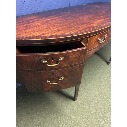 538 - A large Georgian mahogany and inlaid  demi lune sideboard, the large central drawer flanked by dummy... 