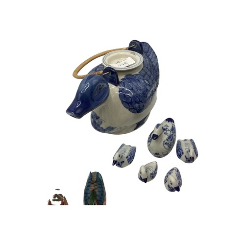 239 - A mixed collection of various ceramics to include a Chinese tea pot ; lidded box , delft style ducks... 