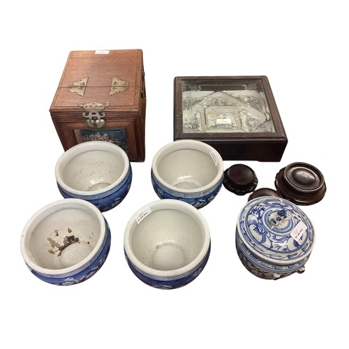 201 - A collection of Oriental items to include a travel dressing box , a nine section Famille Rose servin... 