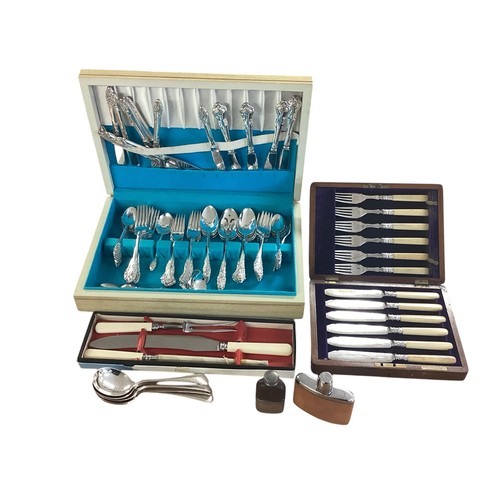 18 - A silver plated boxed canteen of cutlery together with other boxed cutlery sets , two small hip flas... 