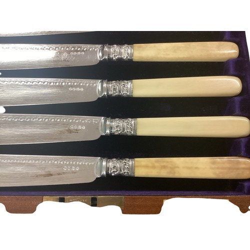 18 - A silver plated boxed canteen of cutlery together with other boxed cutlery sets , two small hip flas... 