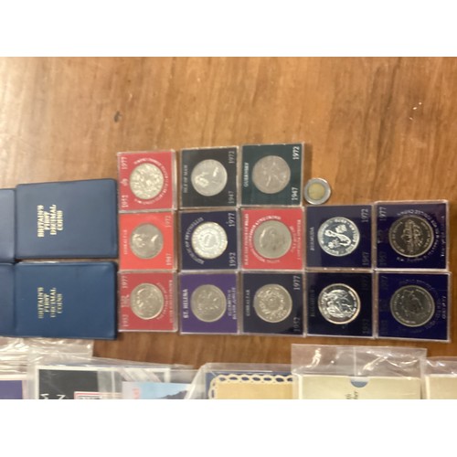 16 - A large collection of UK Royal Mint commemorative coinage.