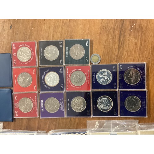 16 - A large collection of UK Royal Mint commemorative coinage.