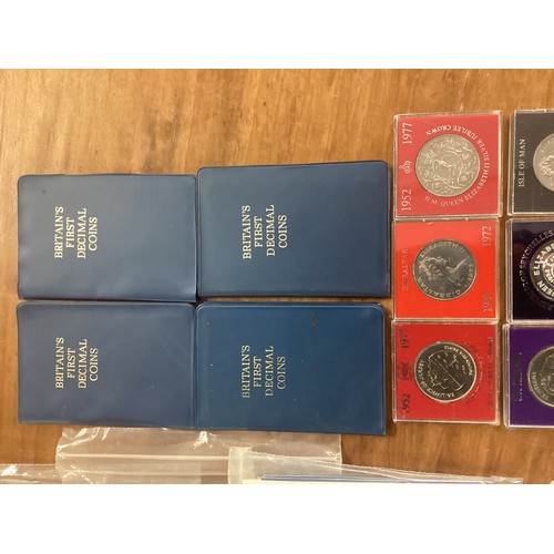 16 - A large collection of UK Royal Mint commemorative coinage.