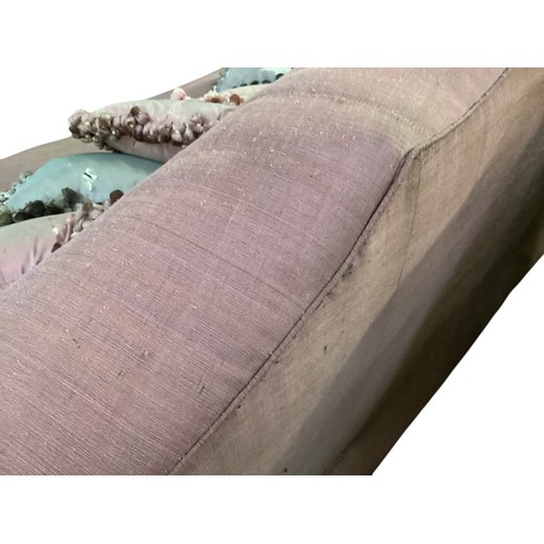 506 - Three seater pink upholstered sofa 209cm wide x 104cm depth x 85cm high, loose wheel, some marks and... 