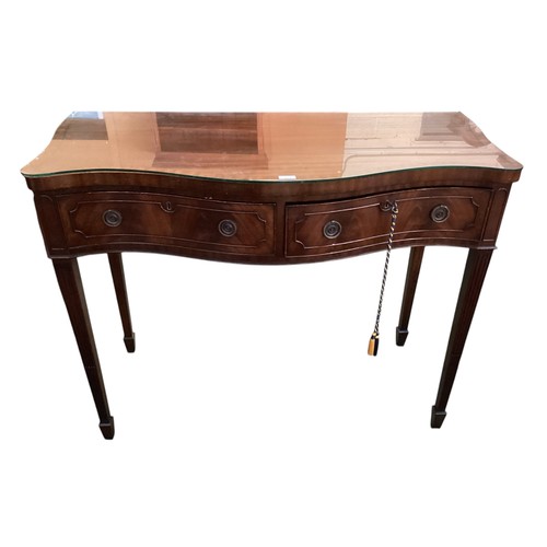 513 - A Pair of C19th serpentine fronted mahogany side tables, glass tops,  115cm wide x 55cm deep x 88cm ... 