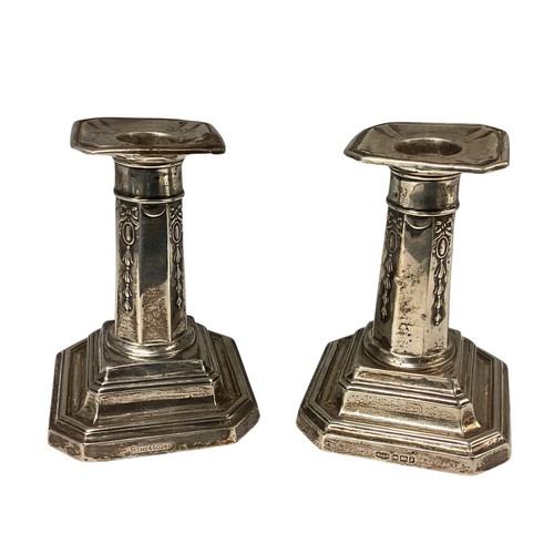 37 - A pair of sterling silver small weighted candlesticks. John Dixon and Son, Sheffield 1908, 10cm(h)