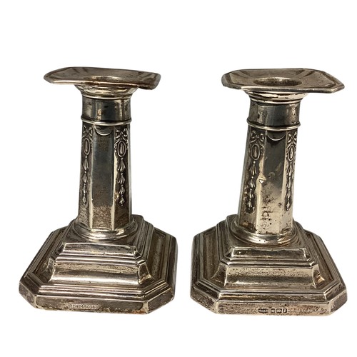 37 - A pair of sterling silver small weighted candlesticks. John Dixon and Son, Sheffield, 1908.10cm(h)