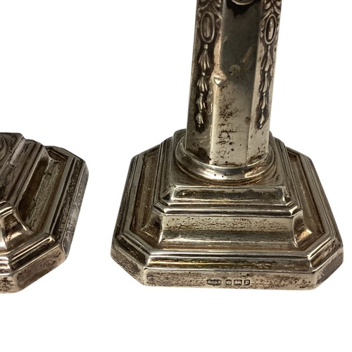 37 - A pair of sterling silver small weighted candlesticks. John Dixon and Son, Sheffield 1908, 10cm(h)