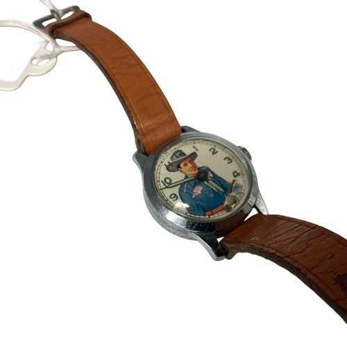 39 - A Vintage 'Roy Rogers' wristwatch. Printed face to white metal case, Moving gun second counter. Muro... 