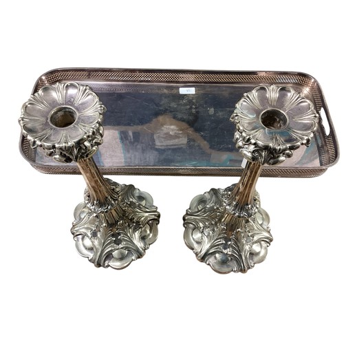 38 - A pair of antique large silver plated candlesticks together with a silver plated galleried tray. Sti... 