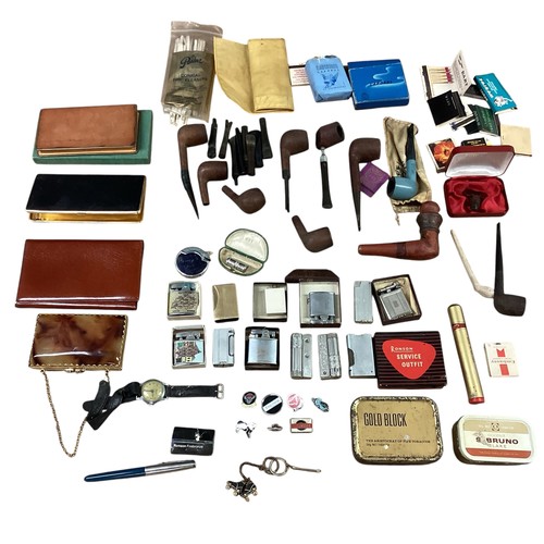 40 - A collection of smoking paraphernalia. Pipes, Ronson lighters cigarette cases etc.