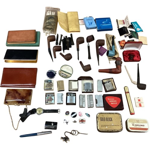 40 - A collection of smoking paraphernalia. Pipes, Ronson lighters cigarette cases etc.