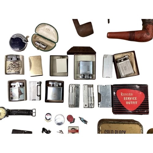 40 - A collection of smoking paraphernalia. Pipes, Ronson lighters cigarette cases etc.