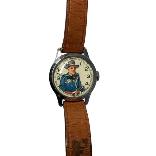 39 - A Vintage 'Roy Rogers' wristwatch. Printed face to white metal case, Moving gun second counter. Muro... 