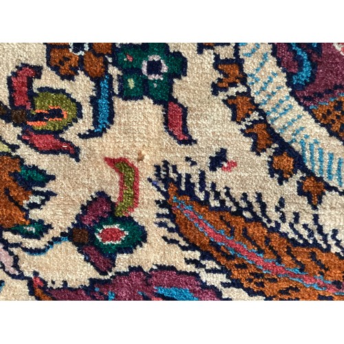 360 - Persian rug, central pattern of flower vases and weeping women and ornate borders with birds. Colour... 