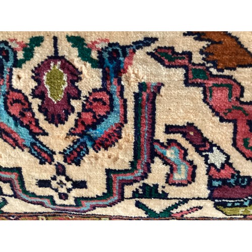 360 - Persian rug, central pattern of flower vases and weeping women and ornate borders with birds. Colour... 