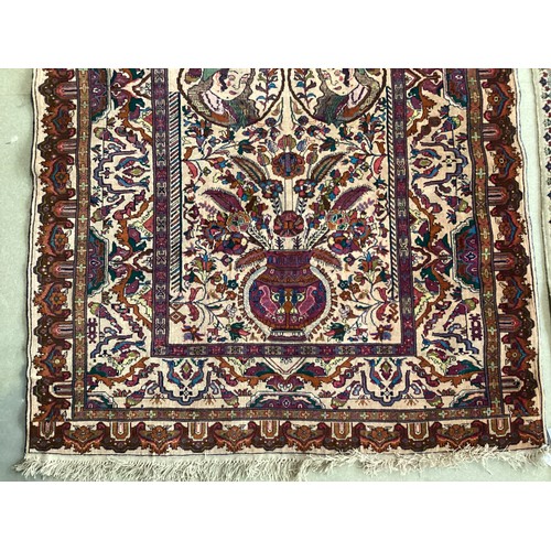 360 - Persian rug, central pattern of flower vases and weeping women and ornate borders with birds. Colour... 