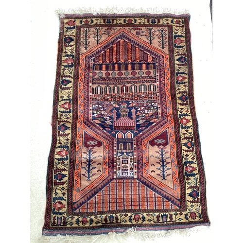 366 - Wool handmade rug with central pattern depicting a temple and border. Main colours are brown, orange... 