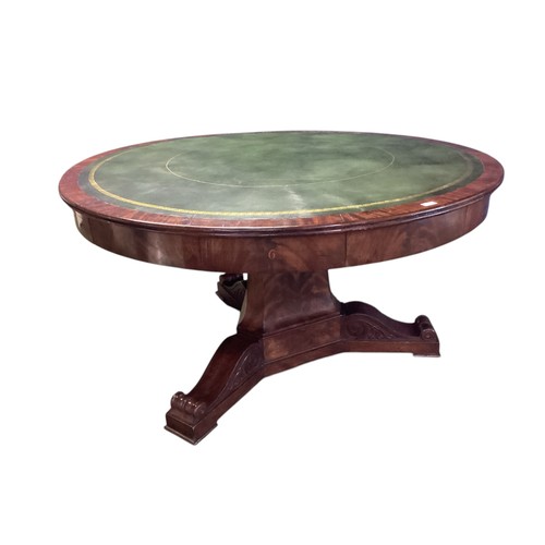 557 - A mahogany C19th Drum table.  circa 1840, with green leather top, 6 numbered drawers , caster wheels... 