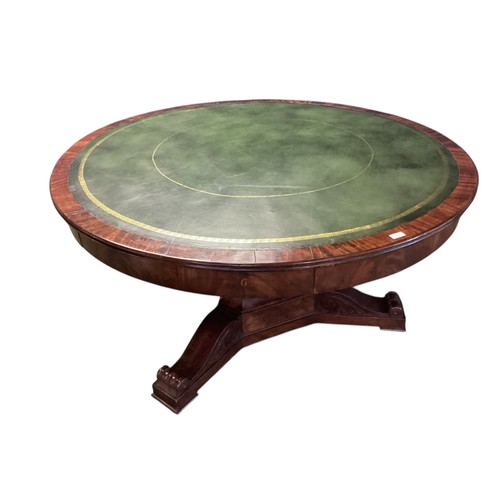 557 - A mahogany C19th Drum table.  circa 1840, with green leather top, 6 numbered drawers , caster wheels... 