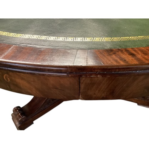 557 - A mahogany C19th Drum table.  circa 1840, with green leather top, 6 numbered drawers , caster wheels... 