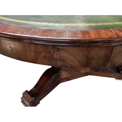 557 - A mahogany C19th Drum table.  circa 1840, with green leather top, 6 numbered drawers , caster wheels... 