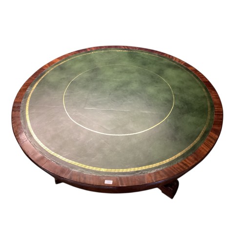 557 - A mahogany C19th Drum table.  circa 1840, with green leather top, 6 numbered drawers , caster wheels... 