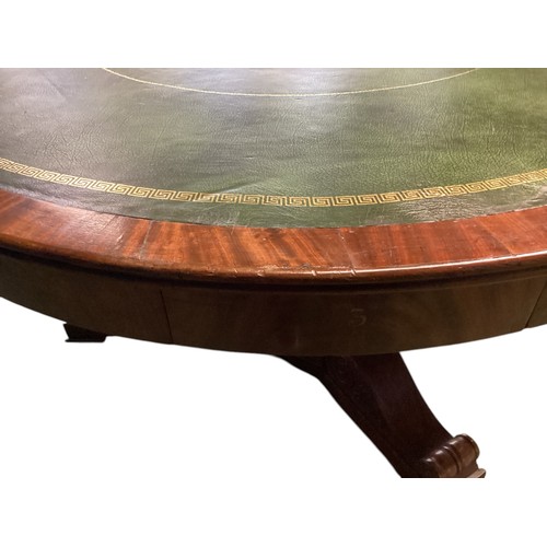 557 - A mahogany C19th Drum table.  circa 1840, with green leather top, 6 numbered drawers , caster wheels... 