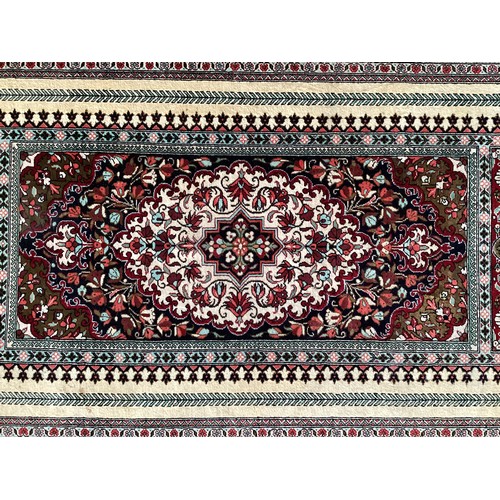 354 - Oriental handmade silk rug/prayer mat, central pattern with ornate border. Colours are mainly red, g... 