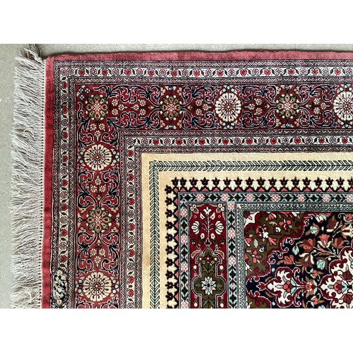 354 - Oriental handmade silk rug/prayer mat, central pattern with ornate border. Colours are mainly red, g... 