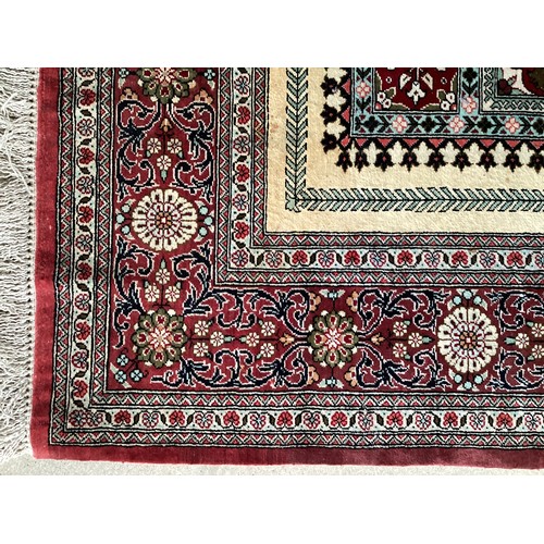 354 - Oriental handmade silk rug/prayer mat, central pattern with ornate border. Colours are mainly red, g... 