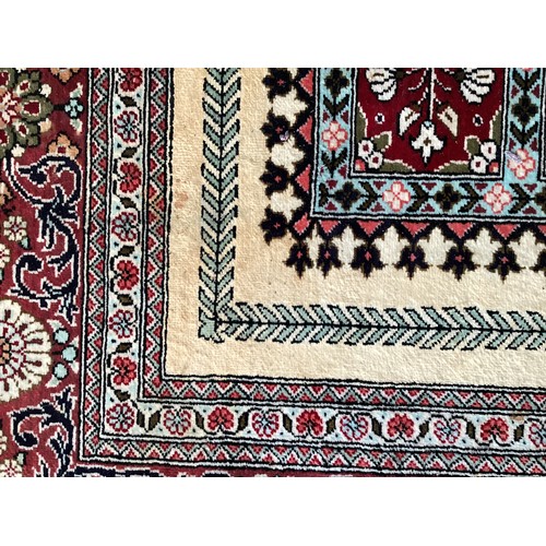 354 - Oriental handmade silk rug/prayer mat, central pattern with ornate border. Colours are mainly red, g... 