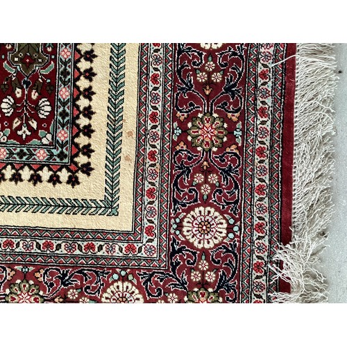 354 - Oriental handmade silk rug/prayer mat, central pattern with ornate border. Colours are mainly red, g... 