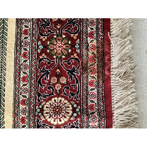 354 - Oriental handmade silk rug/prayer mat, central pattern with ornate border. Colours are mainly red, g... 