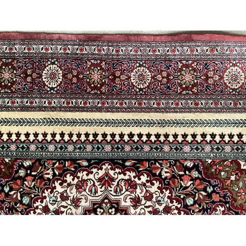 354 - Oriental handmade silk rug/prayer mat, central pattern with ornate border. Colours are mainly red, g... 