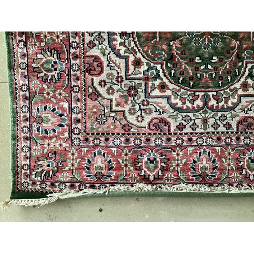 355 - Oriental handmade silk rug with central medallion and pattern borders. Overall colours green, cream ... 