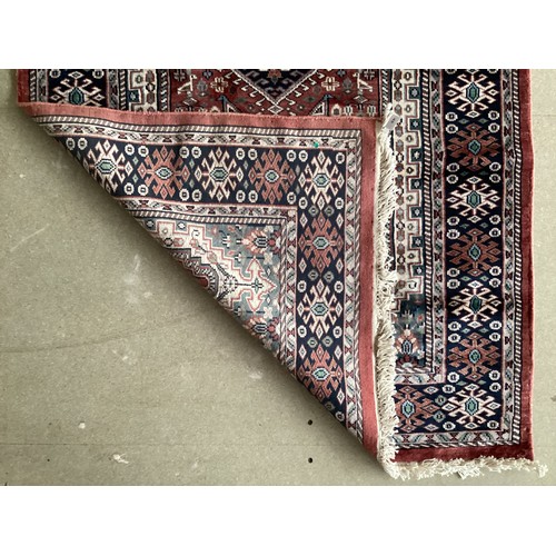 356 - Kashmir silk rug with central three diamond and birds pattern and blue pattern border. Main  colours... 