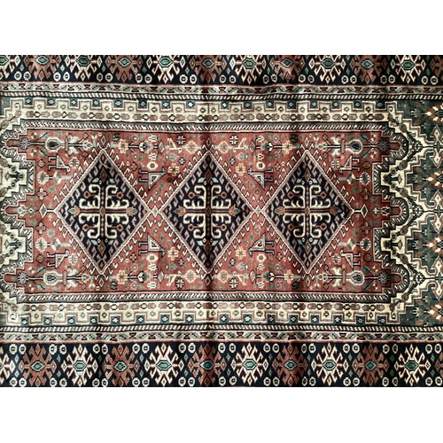 356 - Kashmir silk rug with central three diamond and birds pattern and blue pattern border. Main  colours... 